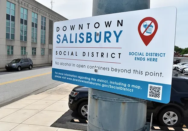City staff has installed social district boundary signs in downtown. The social district will allow consumers to walk around certain parts of downtown with special-marked cups containing alcoholic beverages. Ben Stansell/Salisbury Post